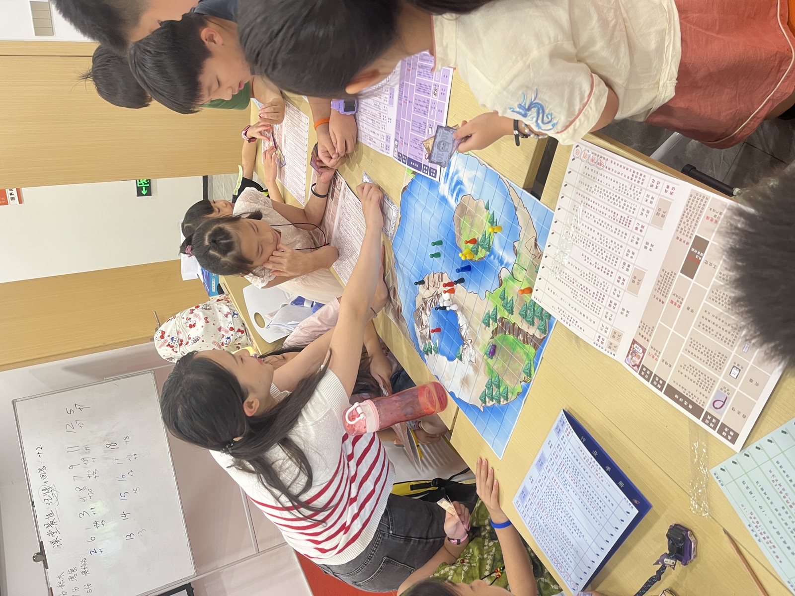 Board-game cards and teenagers laughing through ESG lessons